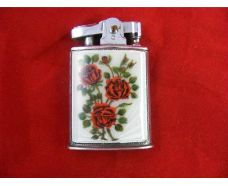 A Ronson Lighter, inset with guilloche enamel panel, in fitted case.