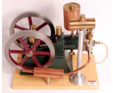 Of freelance design, scratch built scale model of a 'Hit and Miss' petrol engine, the model uses a buzz coil as an ignition s