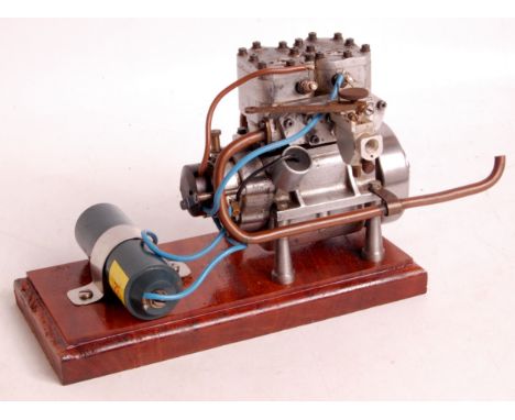 As taken from Edgar T Westbury 'Seagull' designs and later adapted, a scratch built model of a 10cc petrol engine, of twin cy