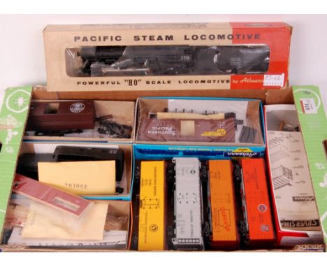 Tray containing 8 made/part made HO American outline freight cars by Athearn, Silver Stream etc (All G) and a HO 4-6-2 engine