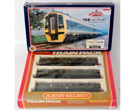 A Hornby BR green class 110 three car DMU (G-BG) and a Bachmann two car class 158 DMU Regional Railways Express livery, tears