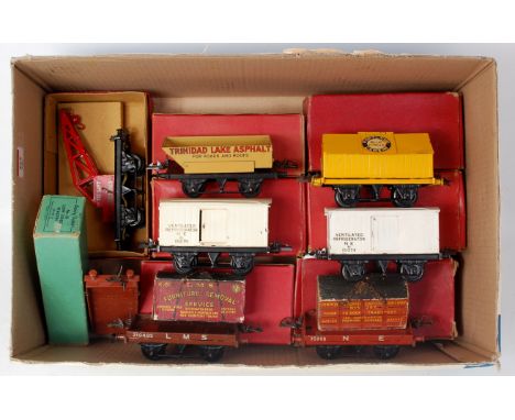 A tray containing 8 Hornby postwar boxed wagons including 2x No. 1 NE refrigerator vans, cement wagon, rotary tipper, NE flat