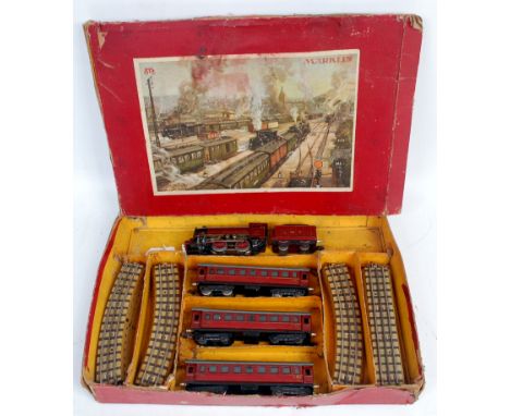 A Marklin prewar (1937) LMS passenger train set containing R700 locomotive, missing smoke deflectors, locmotive has been reso