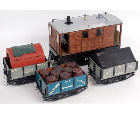 2.5 inch gauge electric model of The Wisbech & Upwell tram engine with single can motor plus 3 various wagons in 0 gauge, plu