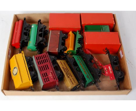 A tray of 10 postwar wagons including cement, BR milk traffic van, buff McAlpine side tipper, green McAlpine side tipper, cra