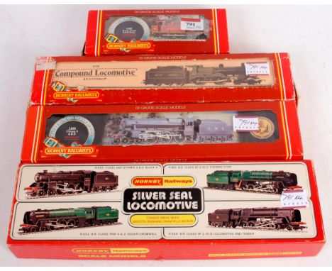 A Hornby R301 LMS red Jinty tank engine (G-BG), R320 LMS black class 5 engine and tender (M-BM), R859 BR class 5 engine and t