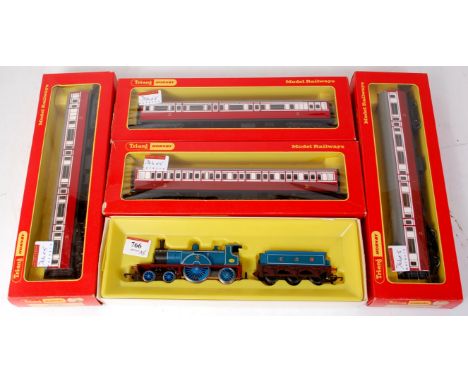 A Triang Hornby R553/4 matt blue Caledonian single engine and tender (NM-BG), together with 2 R427 and 2 R428 matching coache
