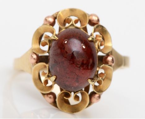 A 575 gold single stone garnet dress ring, with scroll setting, M, 2.4gm. 