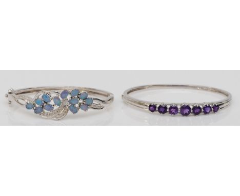 A silver triplet opal set hinged bangle, 60mm, together with a silver amethyst bangle, 35gm. 
