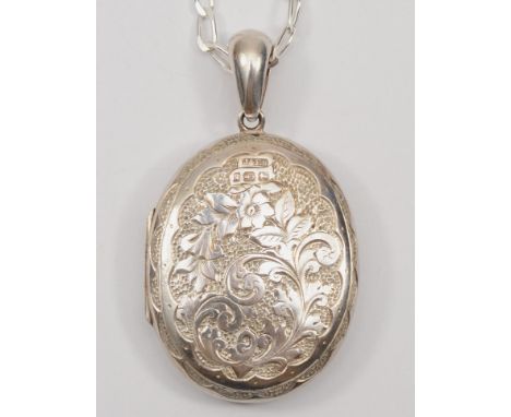 A Victorian silver locket with chased foliate decoration, by J &amp; F.S, Birmingham 1881, on modern silver chain, 52 x 37mm,