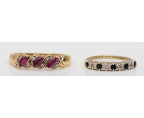 A 9ct gold sapphire and diamond dress ring, J, together with a 9ct gold ruby and diamond dress ring, 3.5gm. 