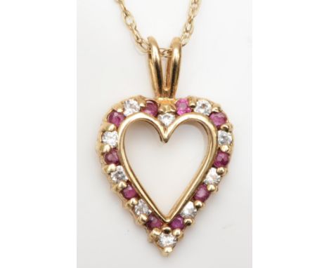 A 9ct gold brilliant cut diamond and ruby heart shaped pendant, on 9k gold chain, 21mm, 2gm. 