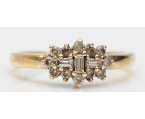 A 9ct gold brilliant and baguette cut diamond cluster ring, L-M, 2.3gm. 