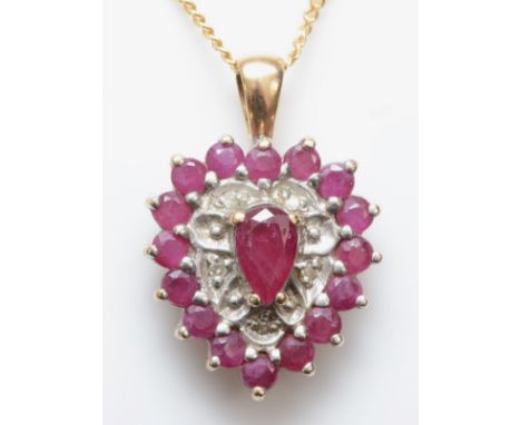 A 9ct gold ruby and eight cut illusion set diamond heart shaped pendant, on a 9ct gold chain, 20mm, 3.2gm. 