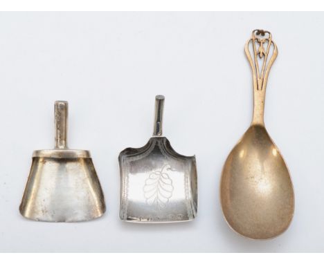 A Georgian silver shovel caddy spoon, by CAB, Birmingham 1803, monogrammed and leaf decoration, together with another Georgia