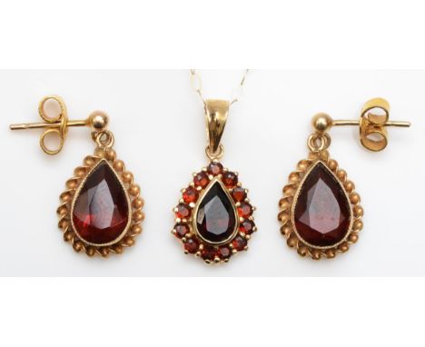 A 9ct gold garnet cluster pendant, on 375 gold chain, 20mm, together with a pair of 9ct gold garnet drop earrings, 4.1gm. 