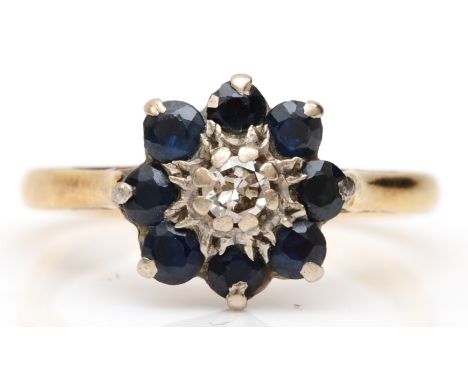 An 18ct gold sapphire and brilliant cut diamond floral dress ring, K, 3.1gm. 