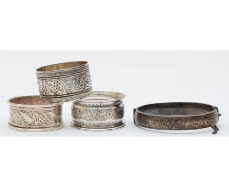 Three napkin rings to include a Victorian example with floral decoration, London 1896, together with a vintage snap bangle, 6