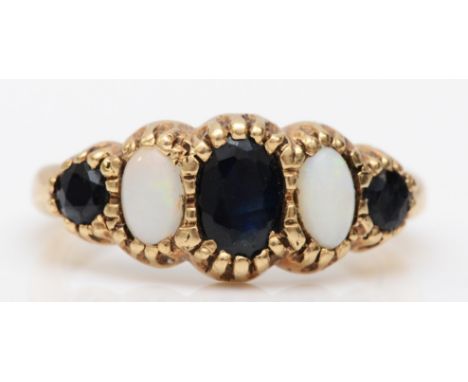 A 9ct gold five stone sapphire and opal dress ring, flashes of green and orange, J-K, 2.2gm. 