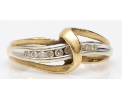 A 9k gold channel set brilliant cut diamond dress ring, L-M, 