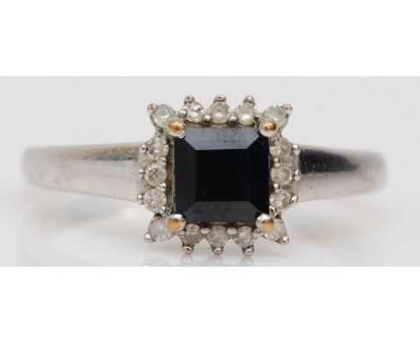 A 9ct white gold square cut sapphire and eight cut diamond dress ring, M-N, 2.2gm. 