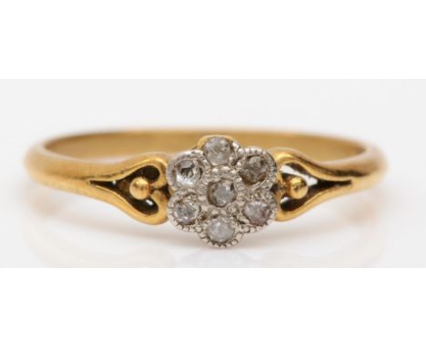 An 18ct gold eight cut diamond floral dress ring, M, 1.8gm 