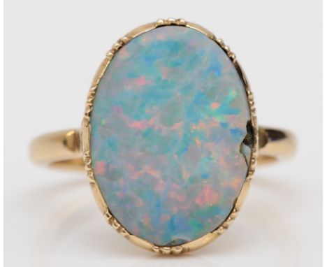 A 9ct gold opal doublet dress ring, l-M, 3.4gm. Condition report - Cracks/chips to the stone