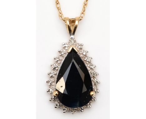 A 9ct gold pear cut sapphire and illusion set diamond pendant, on 375 gold chain, 23mm, 3.6gm. 