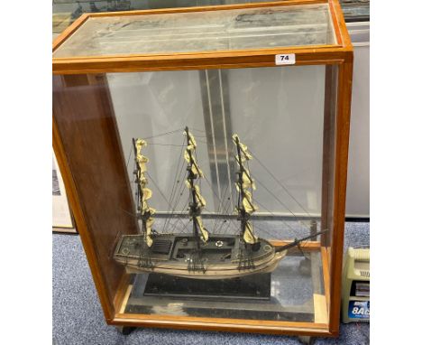 A cased handmade model of a 17th C, 3 masted ship. Case size 69 x 36 x 87cm.