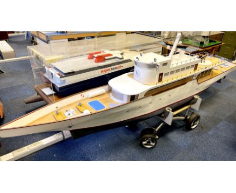 A large working wooden model of a fictitious super yacht named Lakeview. L. 326cm together with trolley and radio equipment a