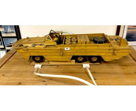 A large scratch built metal and fibreglass model of an amphibious landing craft. L.98cm with radio control.