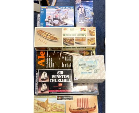 A group of 7 un-made commercial model kits.