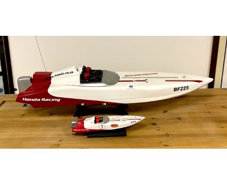 A plastic working model of the Honda Racing team boat L. 91cm radio control obsolete, together with a diecast model of the sa