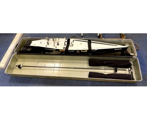 A large customised commercial model of the Americas cup New Zealand boat with case and radio equipment. Case length 203cm.