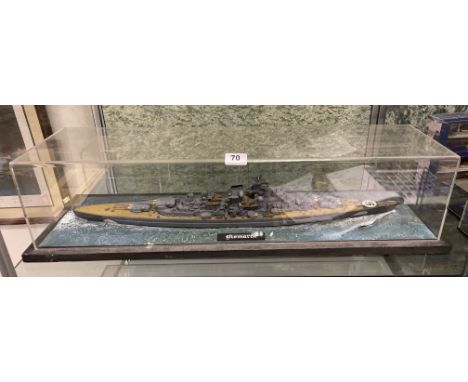 A cased plastic kit model of battleship Bismarck, case L. 82cm, Together with a framed print of its statistics.