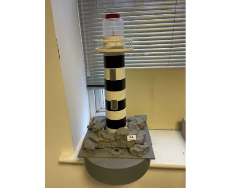 A working scratch built floating model of a lighthouse. Used as turning point for model boat racing, H. 63cm.