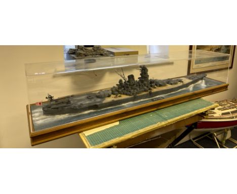 A large cased plastic kit model of the Japanese battleship Yamato, Case size 145 x 33 x 32cm.