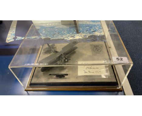 A cased die cast model of a Swordfish MKI biplane, limited edition 97/100, Signed by 3 pilots. Case size 34 x 24 x 15cm.