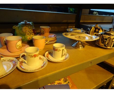 Shelf of mixed cermics including teapot