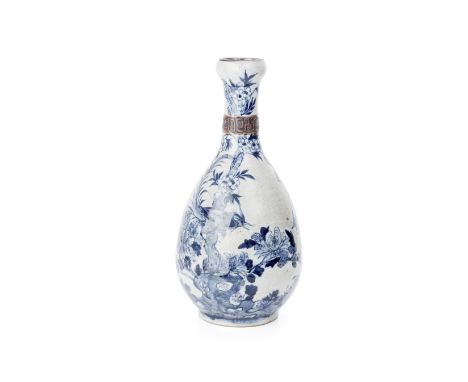 A BLUE AND WHITE NANJING PORCELAIN GARLIC MOUTH BOTTLE VASE Circa 1900, the pear shaped body rising to a garlic mouth, with a