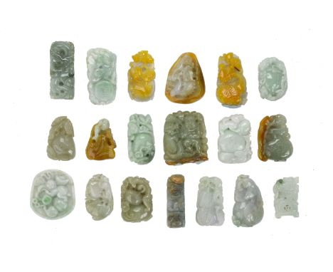 A GROUP OF NINETEEN SMALL JADE CARVINGS
IN various tones of green and brown, the carvings featuring fruit; animals; gourds an