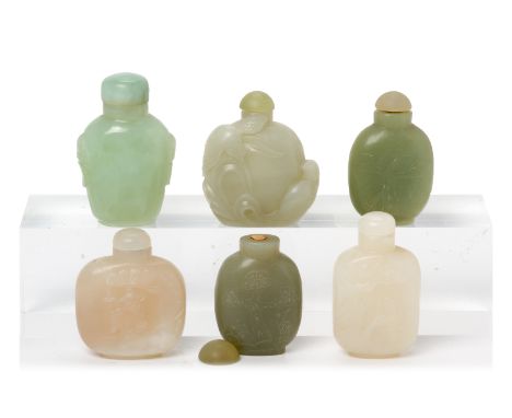 A GROUP OF SIX JADE SNUFF BOTTLES
In varying tones of green, one example carved with two birds; others with a scholar beneath