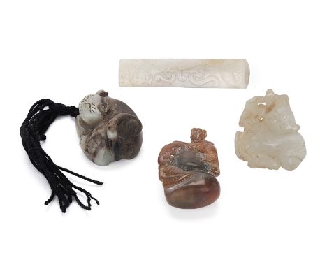 A GROUP OF FOUR JADE CARVINGS
Comprising: one carved as a figure holding a lotus; a cat; a monkey sat atop a gourd or a peach