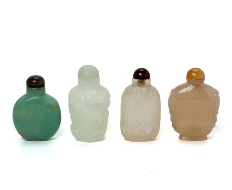 A GROUP OF FOUR JADE AND HARDSTONE SNUFF BOTTLES
With various carved decoration, one plain green example
*
Condition: For a c