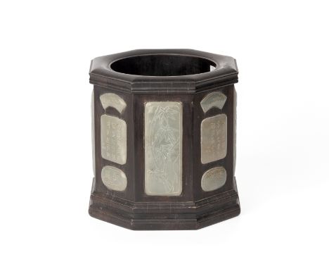A JADE INSET OCTAGONAL HARDWOOD BRUSH POT
The thickly walled pot decorated to the exterior with variously shaped and decorate