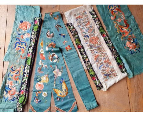 A 19th Century Chinese Qing Dynasty green silk ground belt/sash finely embroidered in a satin stitch with images of colourful