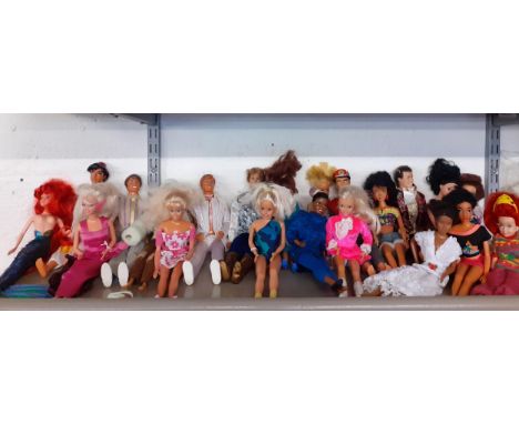 A quantity of Mattel, Hasbro and other dolls, male and female, 1960's - 1990's to include Barbie, Ken and Captain Scarlett to