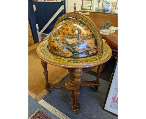 A vintage globe drinks cabinet having baluster supports and on four castersLocation:RAB 