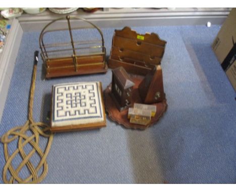 A mixed lot to include a mahogany letter rack, a metronome, and an oak desk date calendar, a brass and mahogany magazine rack