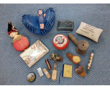 A group of vintage pin cushions and sewing related items to include a British Empire Exhibition needle case 
